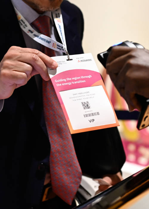 Attendees around an exhibition stand