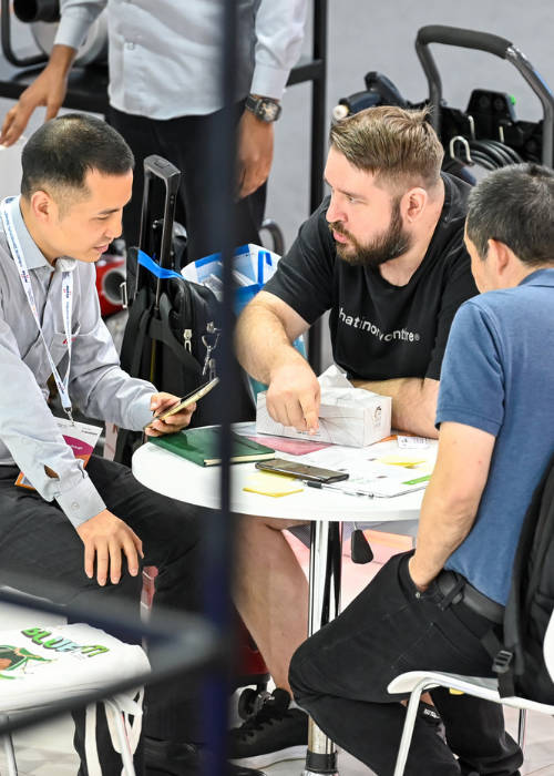 Speakers sitting at a talk